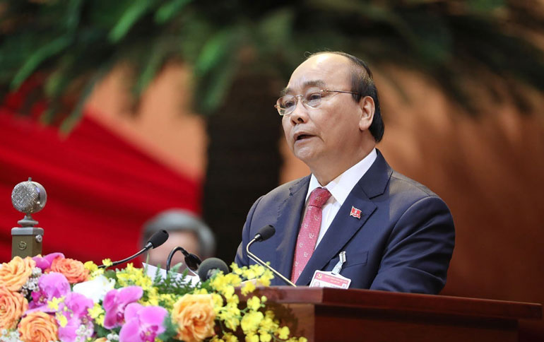 Đồng chí Nguyễn Xuân Phúc - Ủy viên Bộ Chính trị, Thủ tướng Chính phủ thay mặt Đoàn Chủ tịch đọc diễn văn khai mạc Đại hội